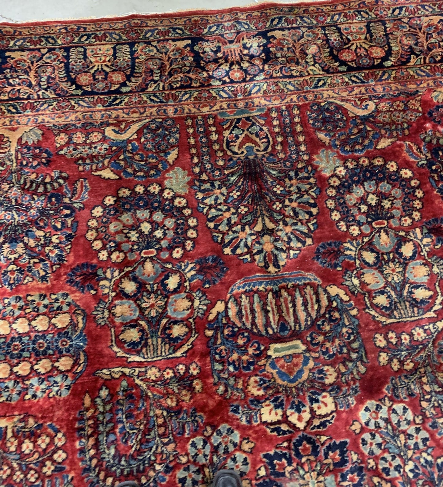 Handmade antique Muiddle Eastern rug in traditional floral design. The rug is from the beginning of 20th century in original good condition.
