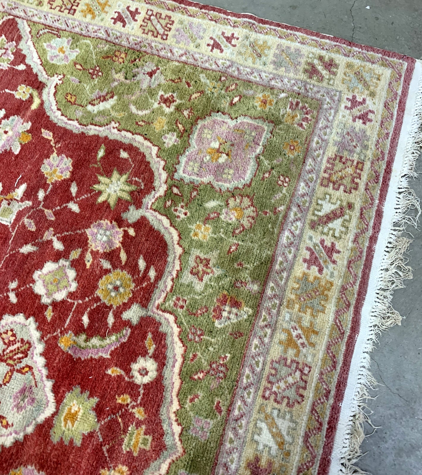 Handmade vintage Turkish Oushak rug in traditional design and natural dyes. The rug is from the beginning of 20th century in original good condition. 