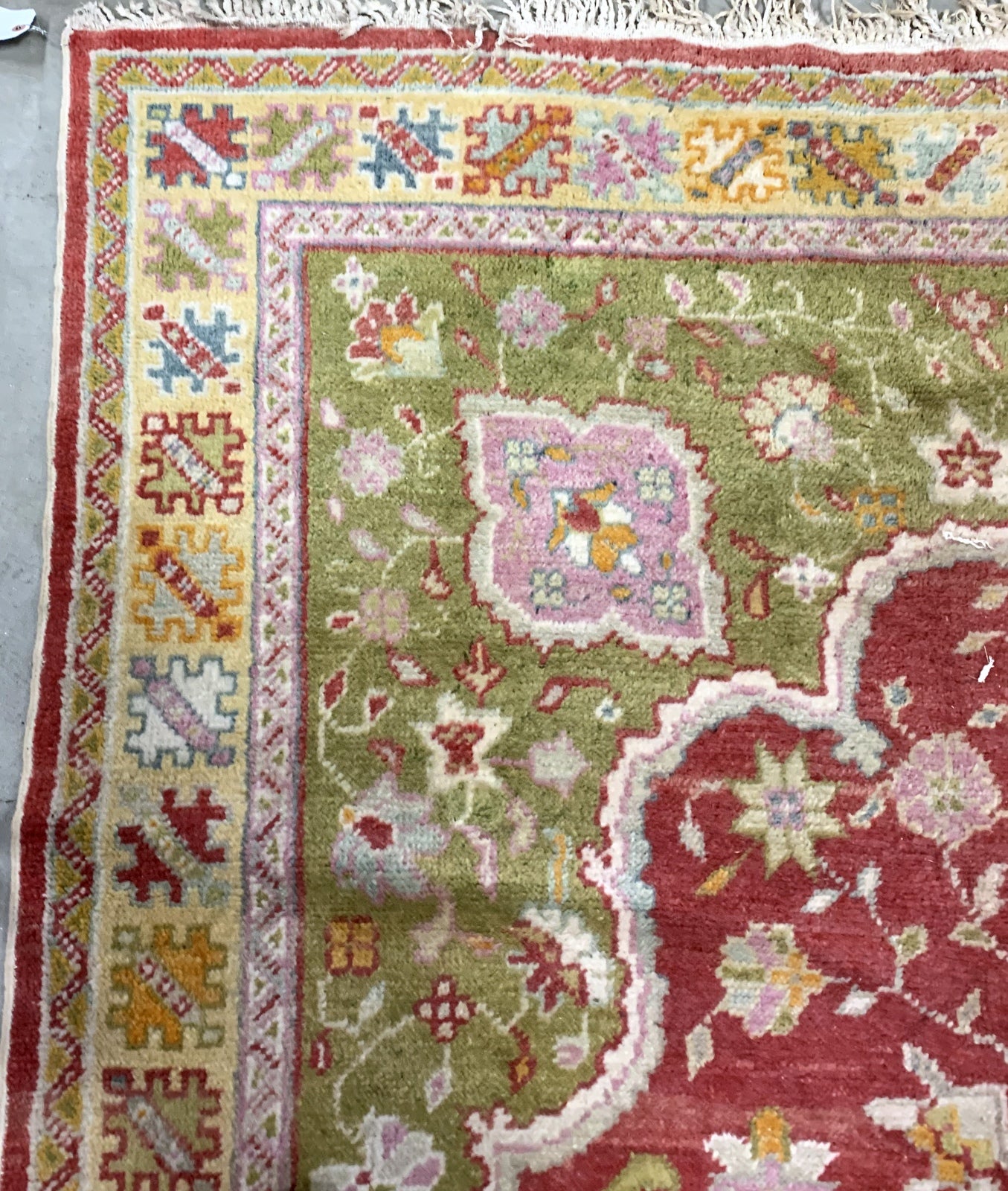 Handmade vintage Turkish Oushak rug in traditional design and natural dyes. The rug is from the beginning of 20th century in original good condition. 