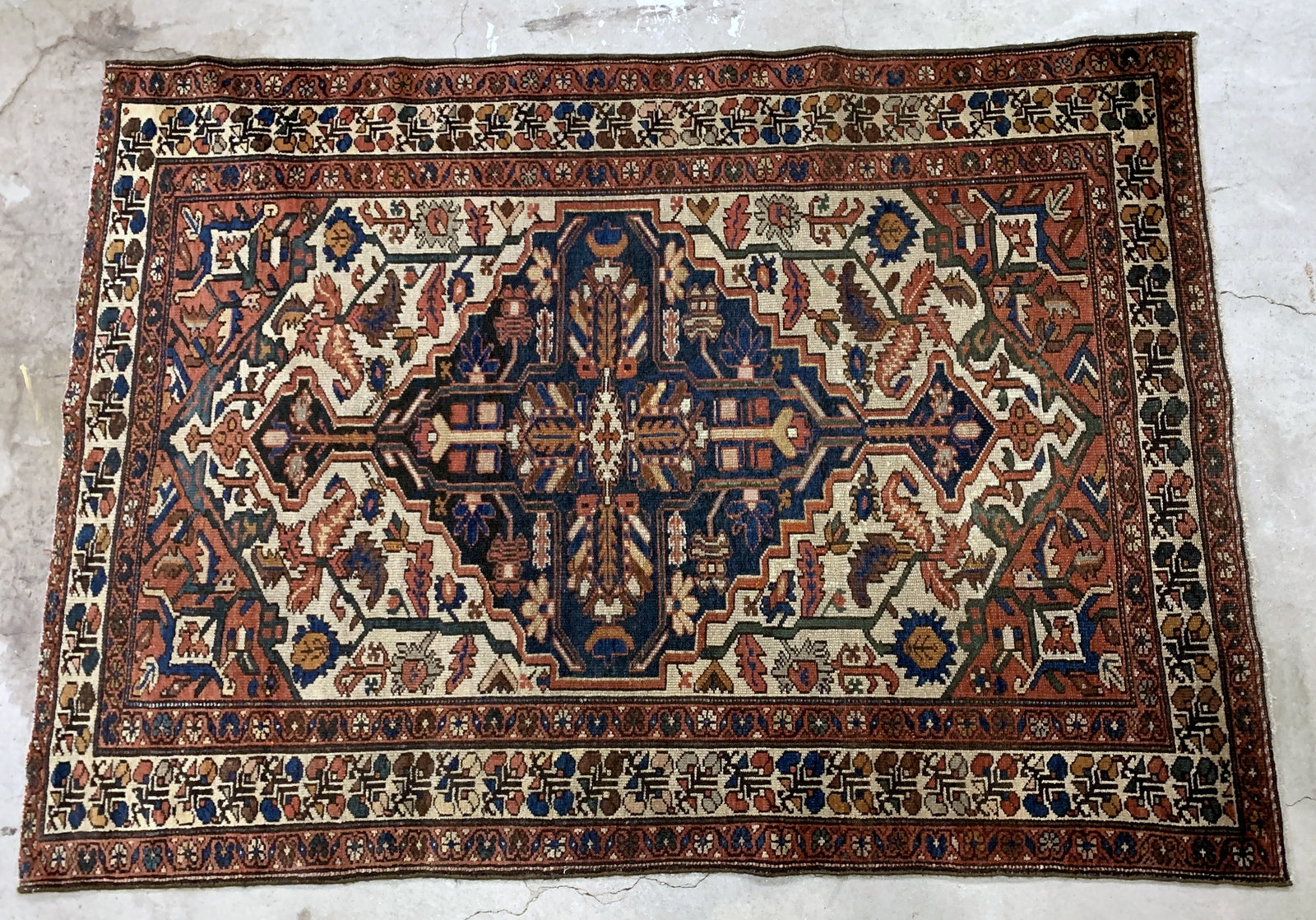 Handmade antique Middle Eastern Malayer rug in traditional design. The rug is from the beginning of 20th century in original good condition.