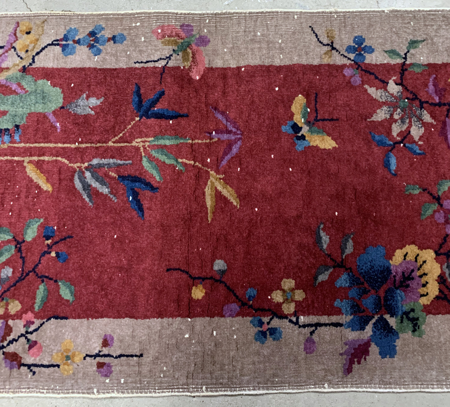 Handmade antique Art Deco Chinese rug in red shade. The rug is from the beginning of 20th century in original condition, it has some low pile. 
