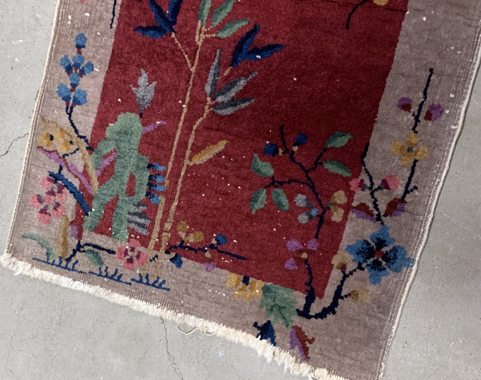 Handmade antique Art Deco Chinese rug in red shade. The rug is from the beginning of 20th century in original condition, it has some low pile. 