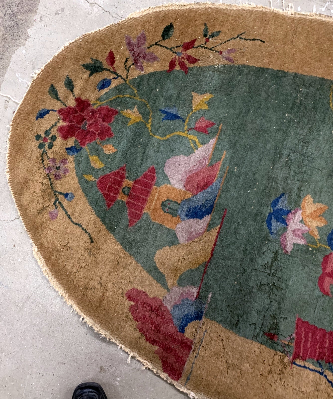 Handmade antique Art Deco Chinese rug in green and yellow shades. The rug is from the beginning of 20th century in original condition, it has some moth damages. 