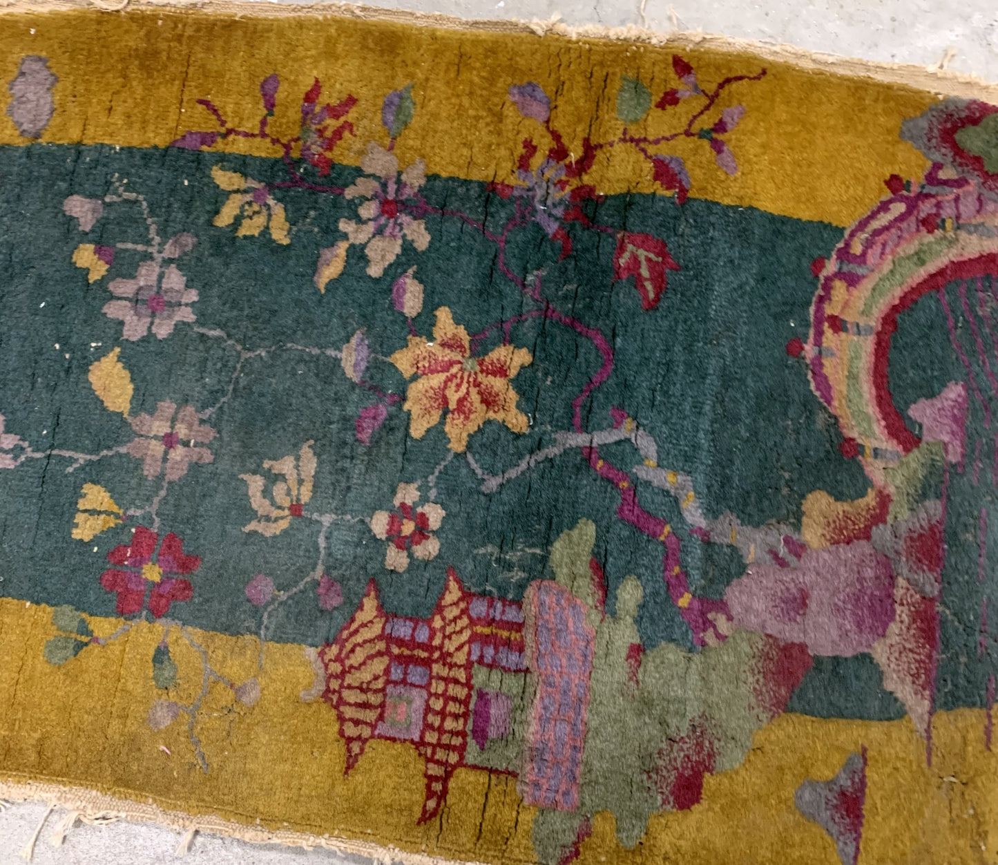 Handmade antique Art Deco Chinese rug in green and yellow shades. The rug is from the beginning of 20th century in original condition, it has some signs of age. 