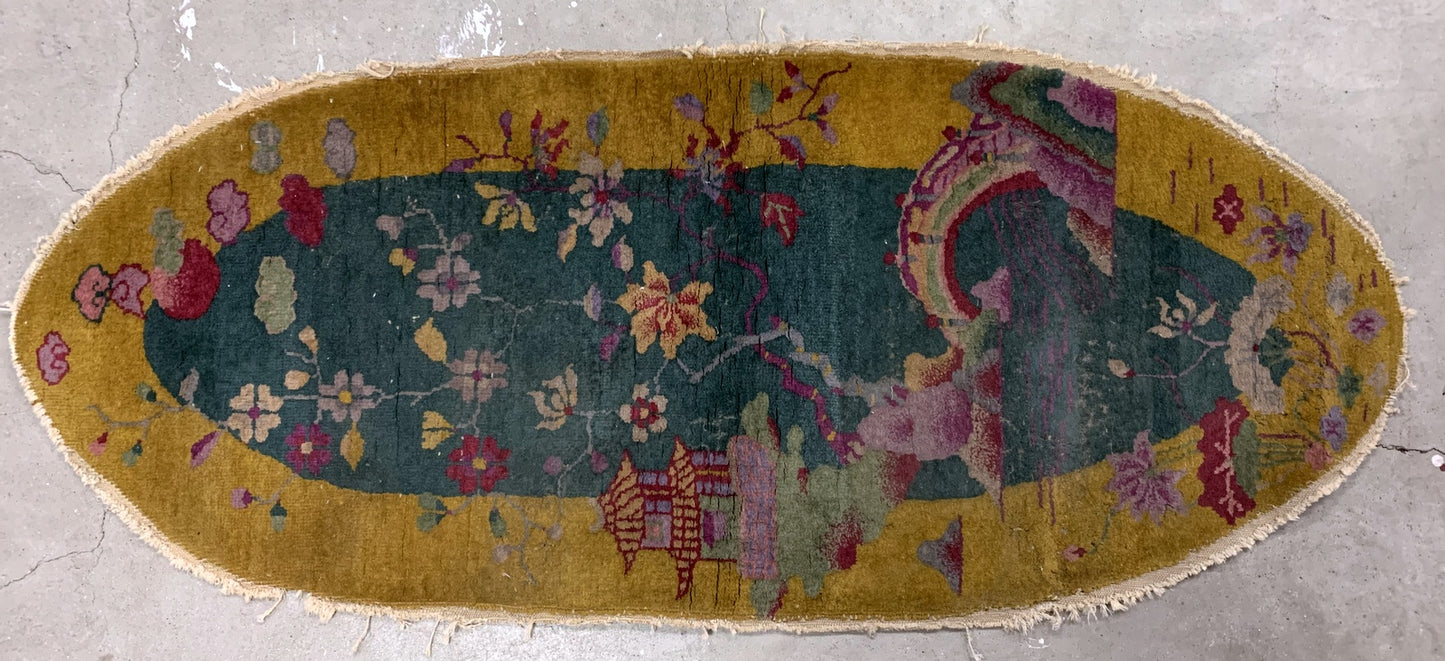 Handmade antique Art Deco Chinese rug in green and yellow shades. The rug is from the beginning of 20th century in original condition, it has some signs of age. 