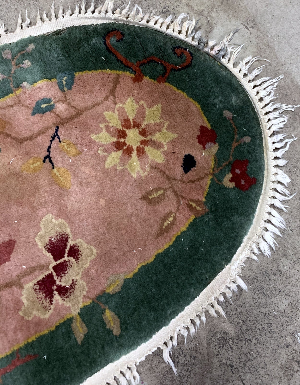 Handmade antique Art Deco Chinese rug in light burgundy and green color. The rug is from the beginning of 20th century in original good condition. 