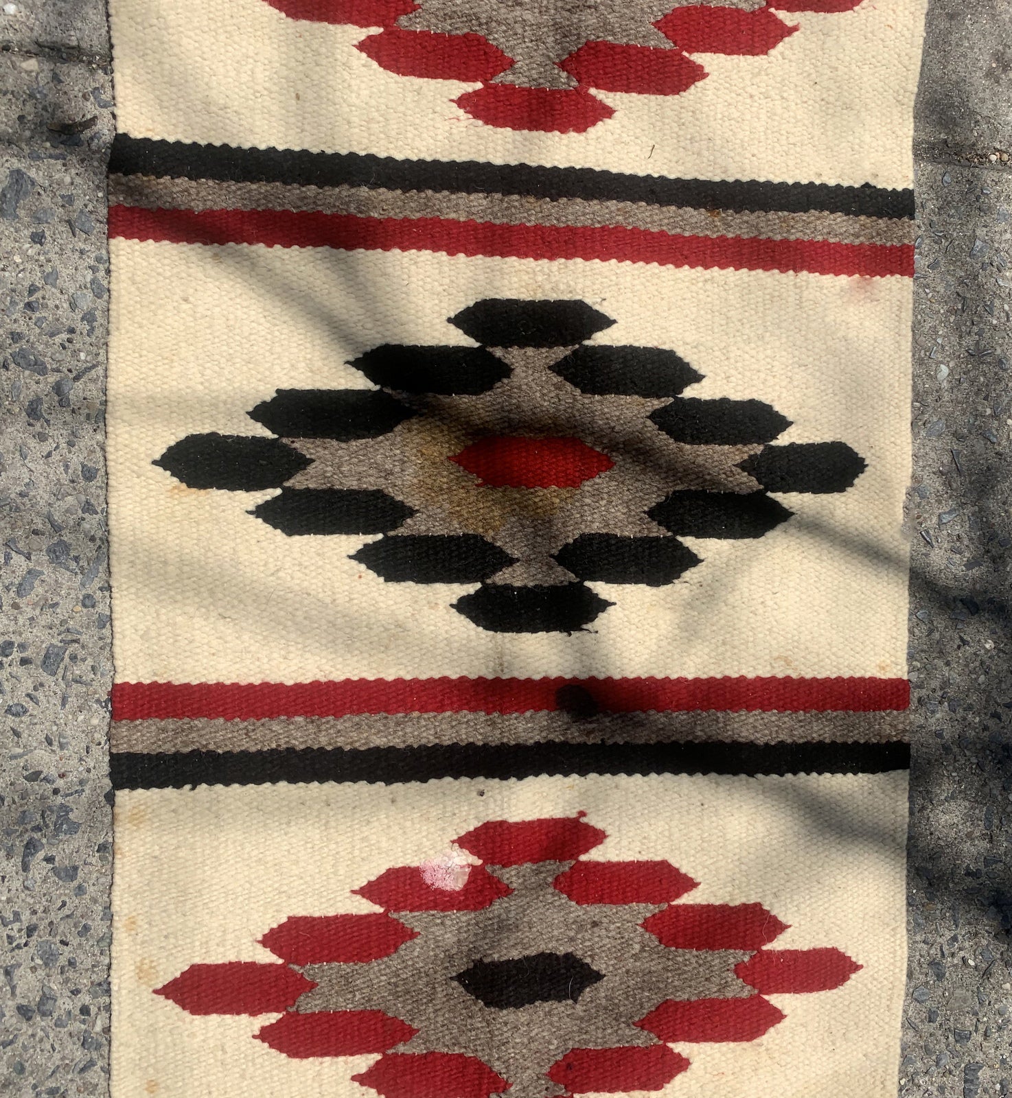 Handmade antique Native American Navajo rug in white color. The rug is from the beginning of 20th century in original condition, it has some age discolorations.