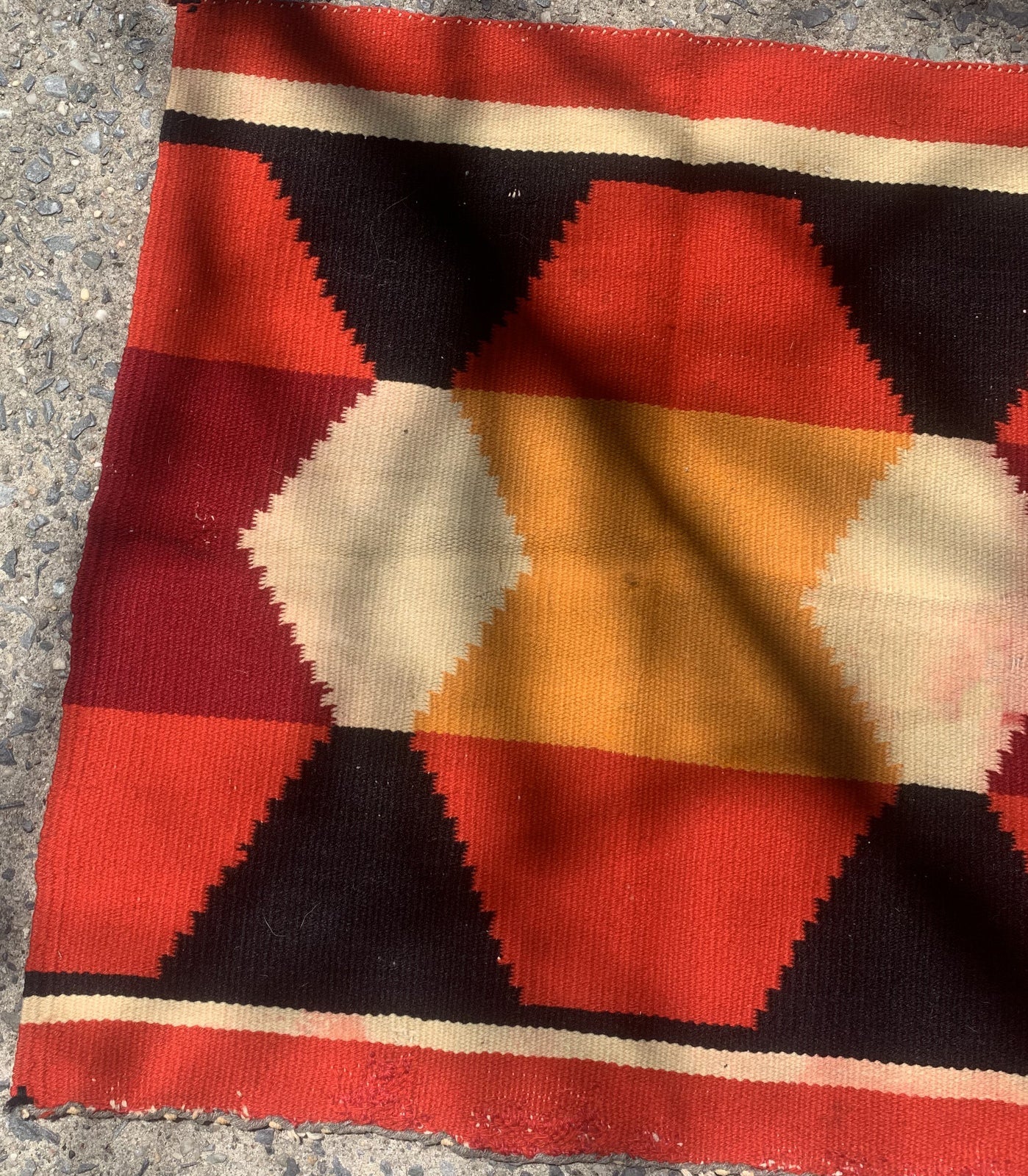 Handmade antique Native American Navajo baby blanket in colorful shades. The rug is from the end of 19th century in original condition, it has some age discolorations.