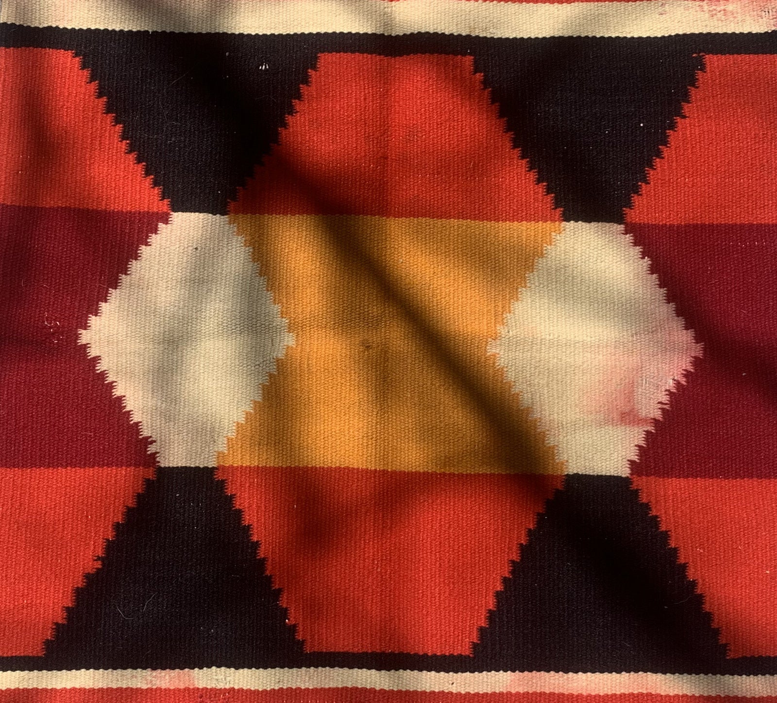 Handmade antique Native American Navajo baby blanket in colorful shades. The rug is from the end of 19th century in original condition, it has some age discolorations.