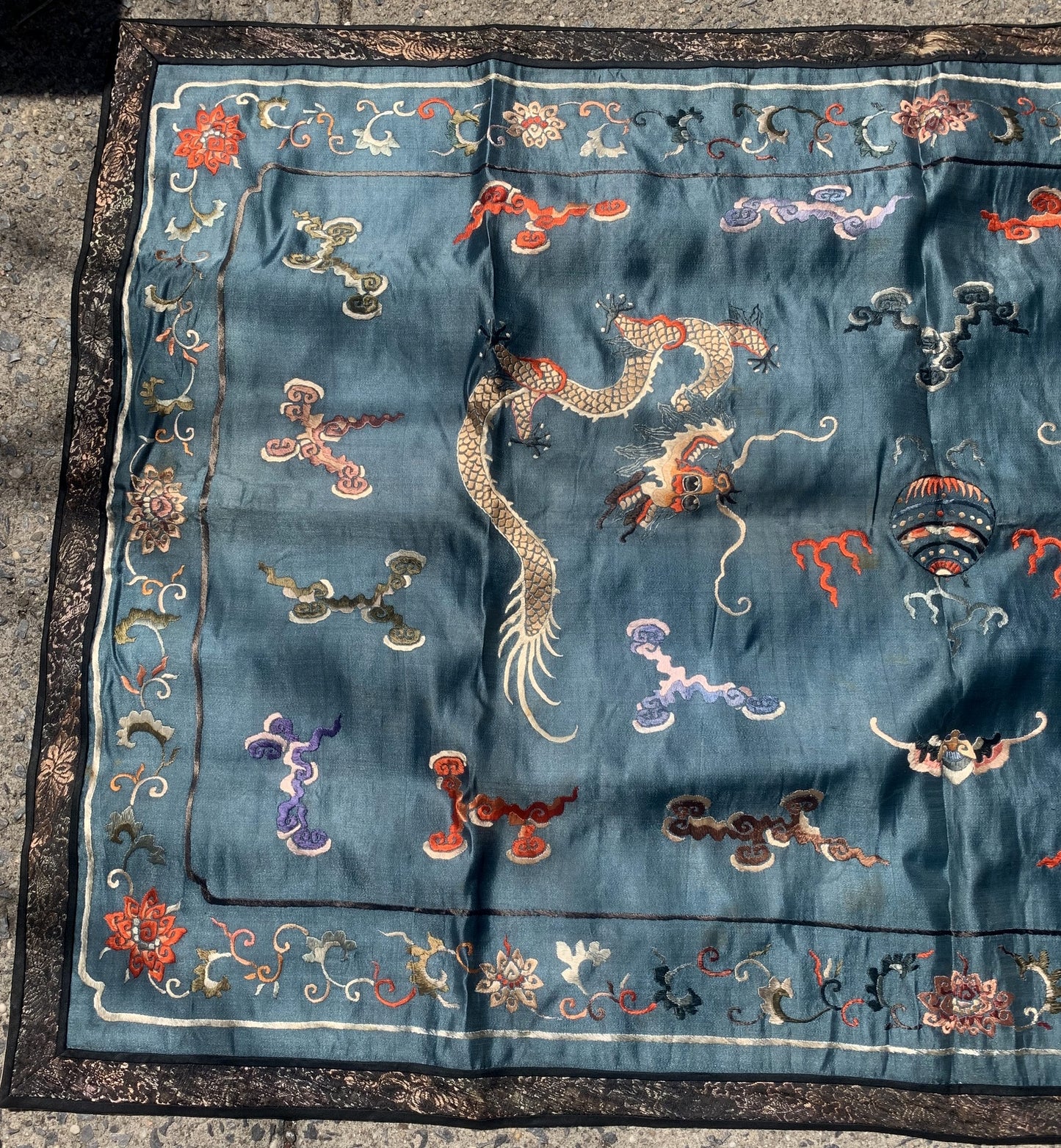 Handmade antique Chinese Dragon designed textile in silk. This tapestry is from the end of 19th century in original condition, it has some age discolorations.