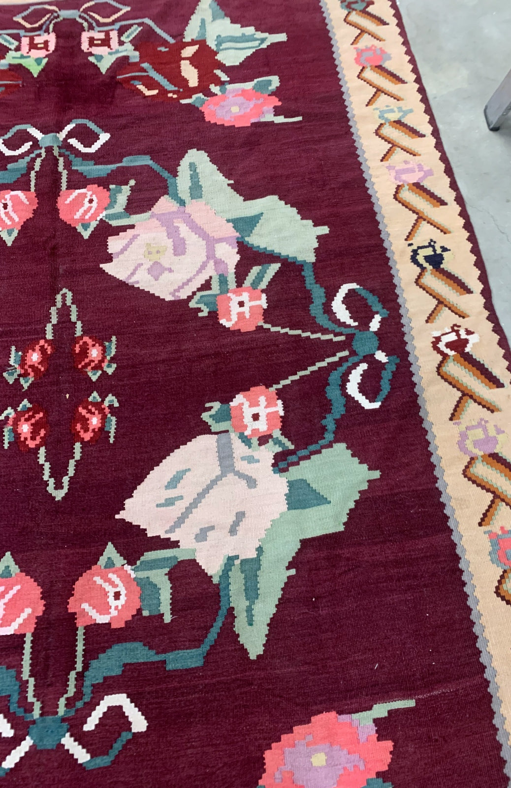 Handmade vintage Bessarabian kilim from Romania and burgundy and beige shades. The rug is from the middle of 20th century in original good condition.