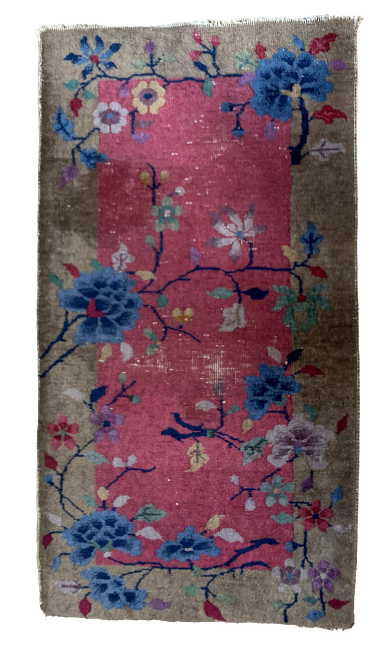 Handmade Art Deco Chinese rug from the 1920s with vibrant colors and floral motif.