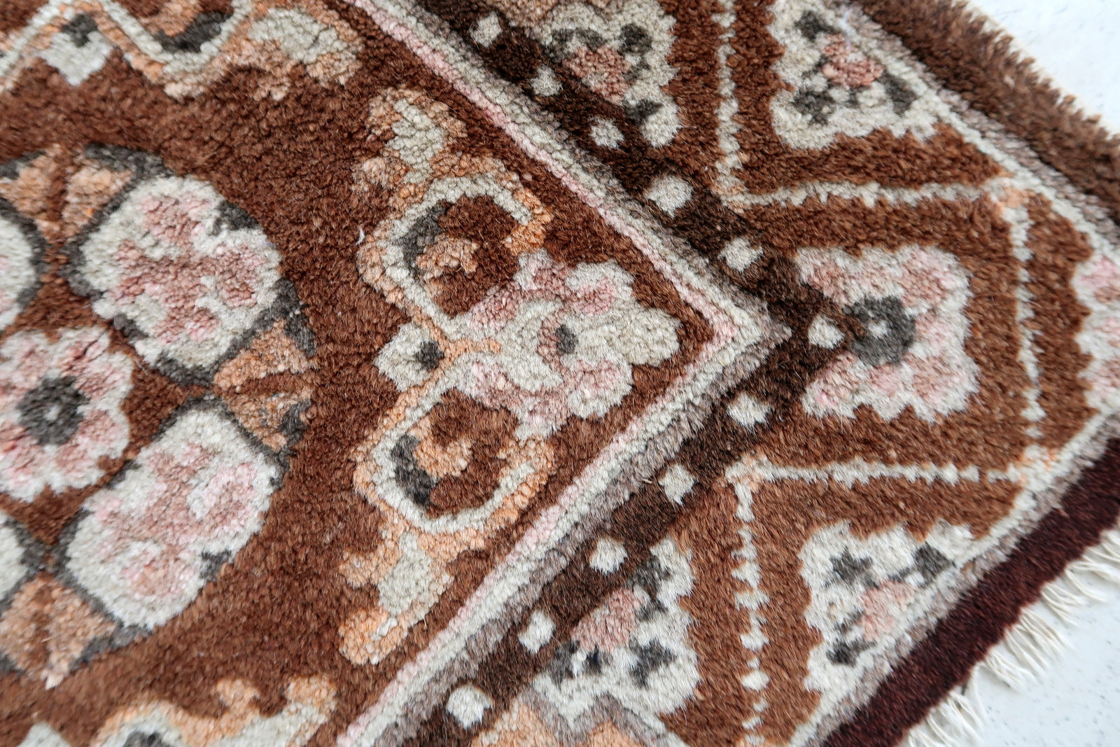 Handmade vintage Mongolian collectible mat in brown shade. The rug is from the middle of 20th century in original good condition.