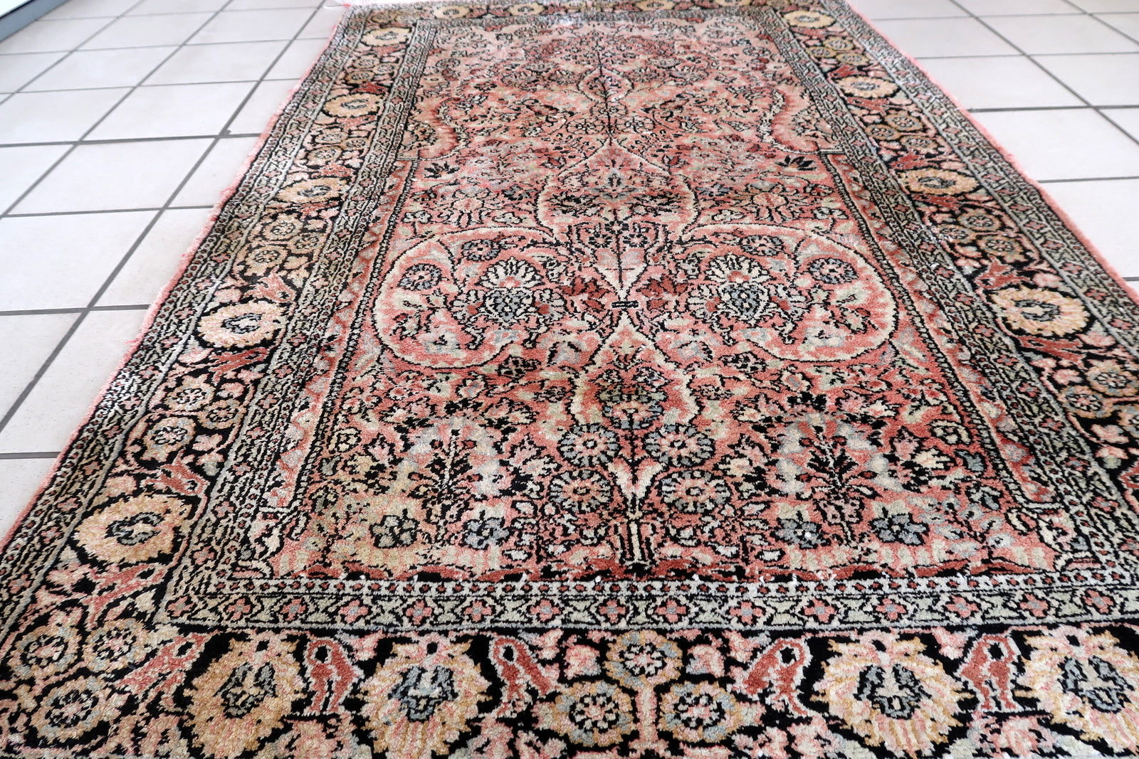 Handmade vintage Persian Tabriz silk rug in pink and black shades. The rug is from the end of 20th century in original good condition. It has a tree of life design. This rug is for praying.
