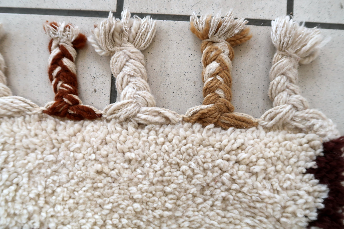 Handmade vintage Moroccan Berber woolen  rug in white and brown colors. The rug is from the end of 20th century in original good condition.