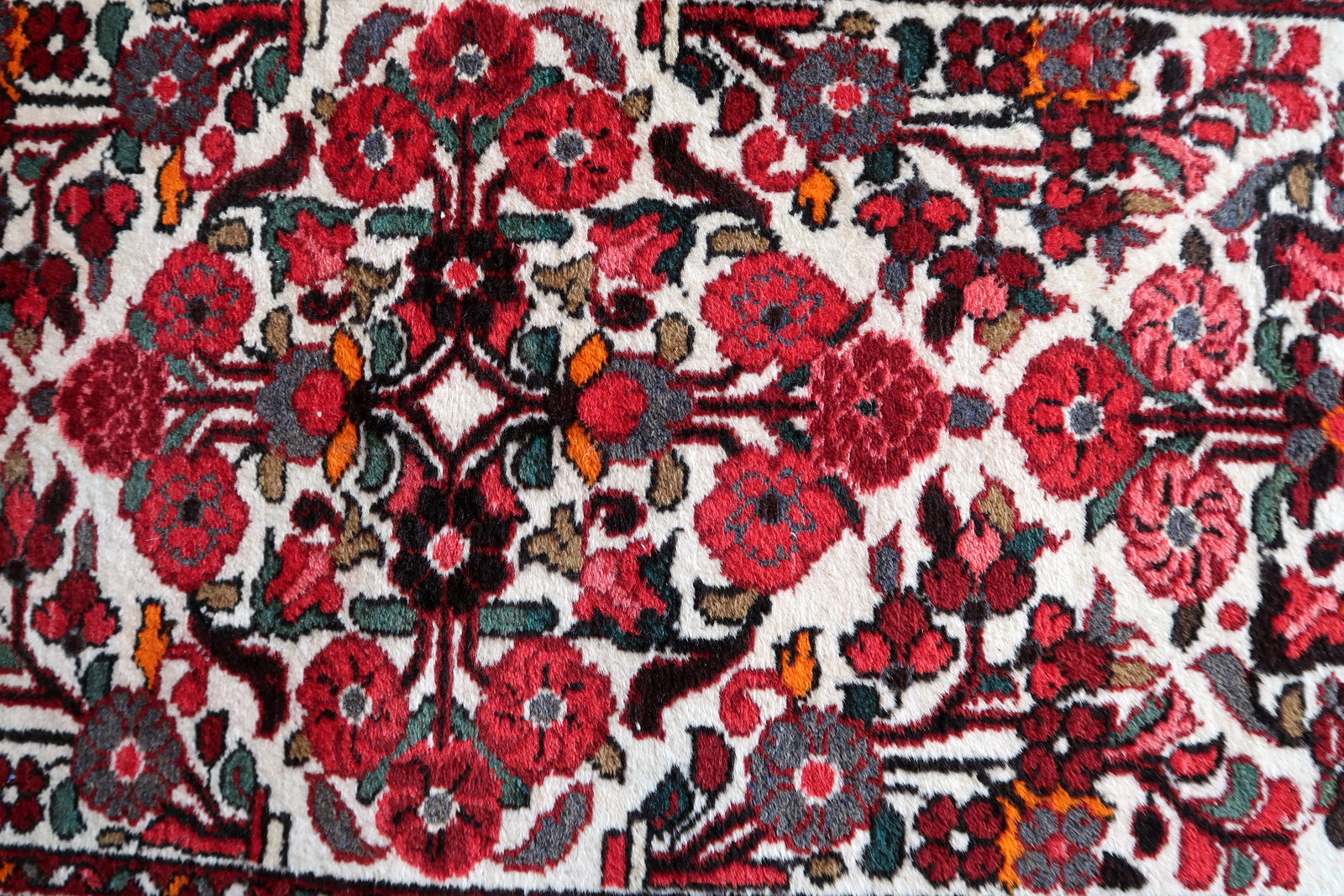 Handmade antique Persian Malayer runner in floral design. The runner is from the beginning of 20th century in original good condition.