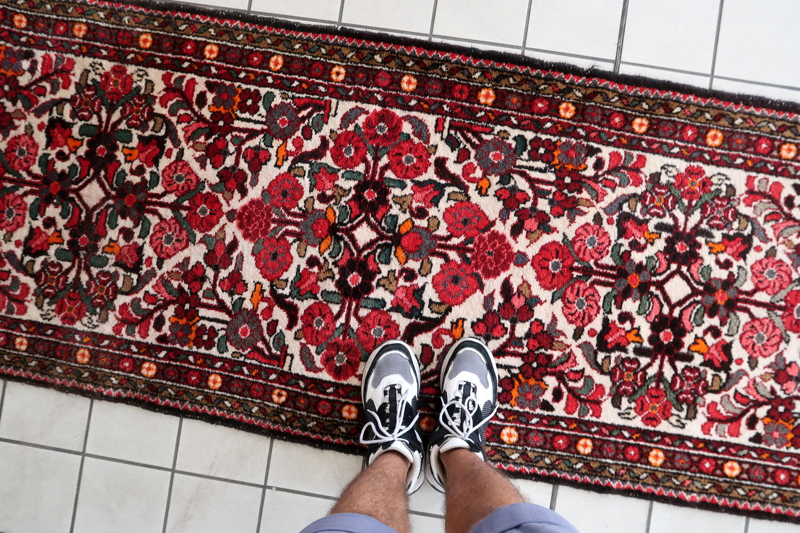 Handmade antique Persian Malayer runner in floral design. The runner is from the beginning of 20th century in original good condition.