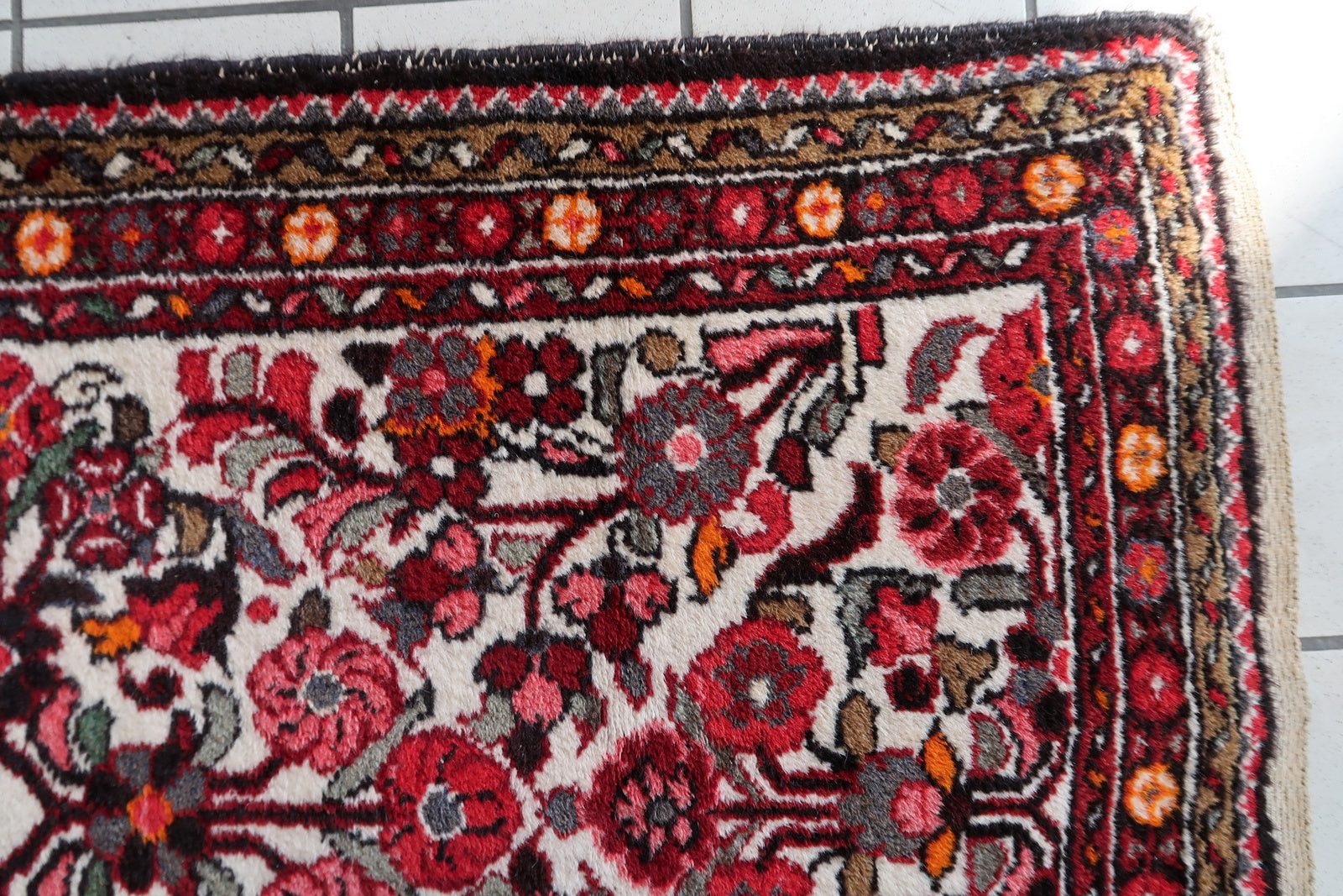Handmade antique Persian Malayer runner in floral design. The runner is from the beginning of 20th century in original good condition.