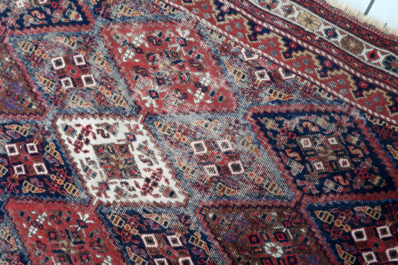 Handmade antique Persian Afshar distressed rug 1910s