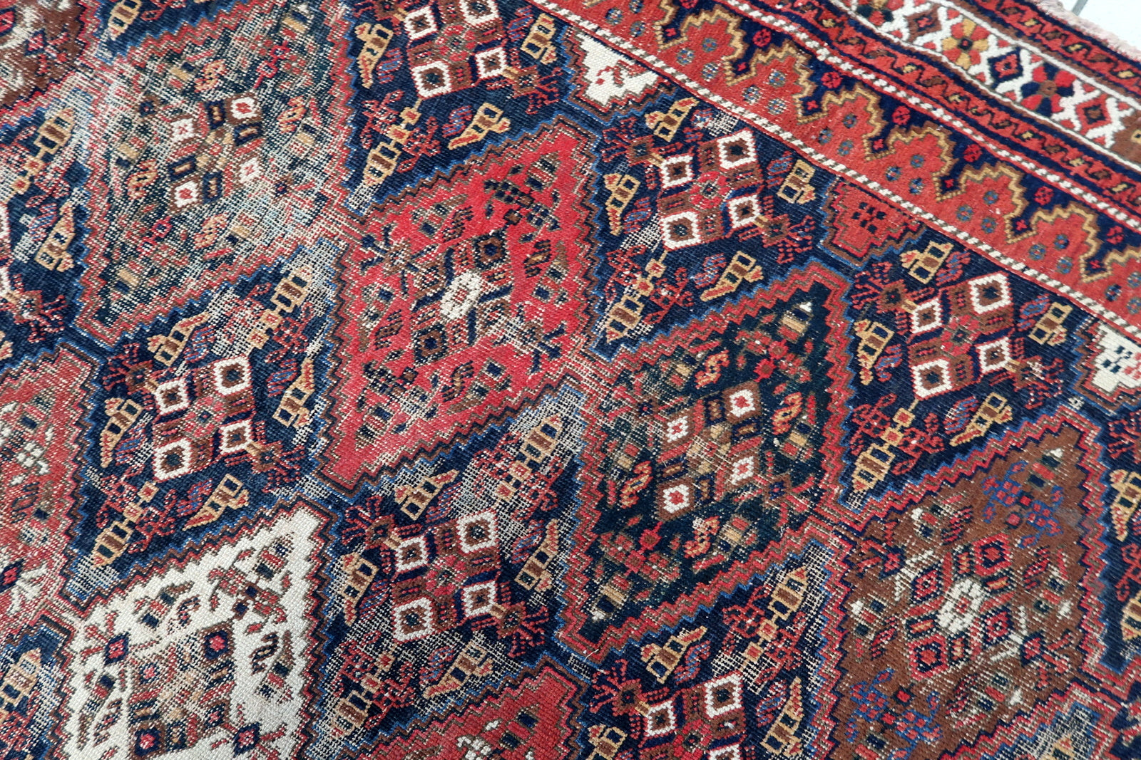 Handmade antique Persian Afshar distressed rug 1910s