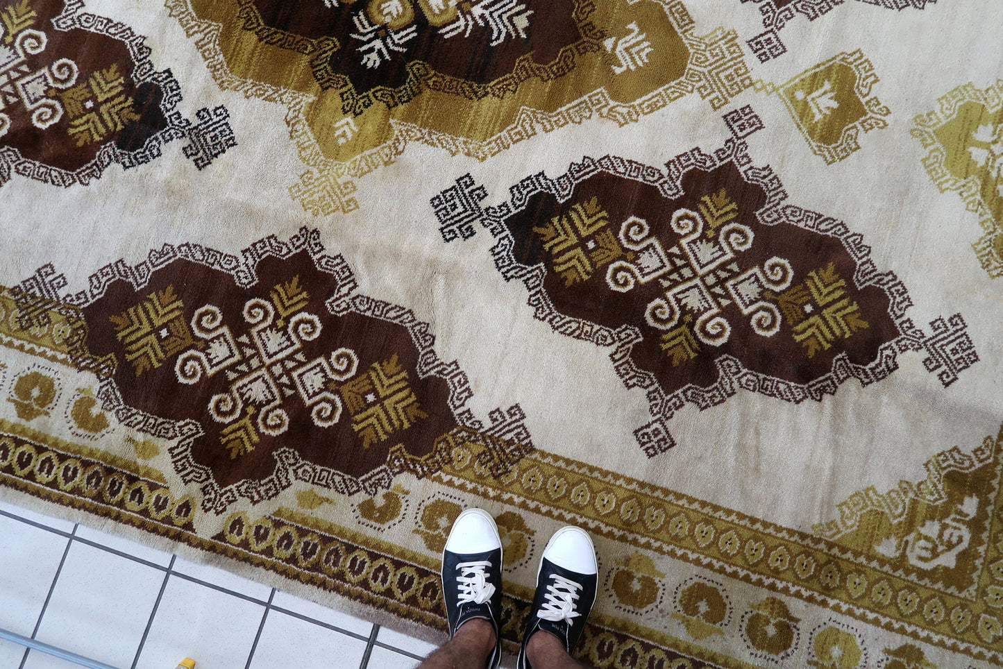 Vintage French Savonnerie rug in beige, brown and golden shades. The rug is from the middle of 20th century in original good condition.
