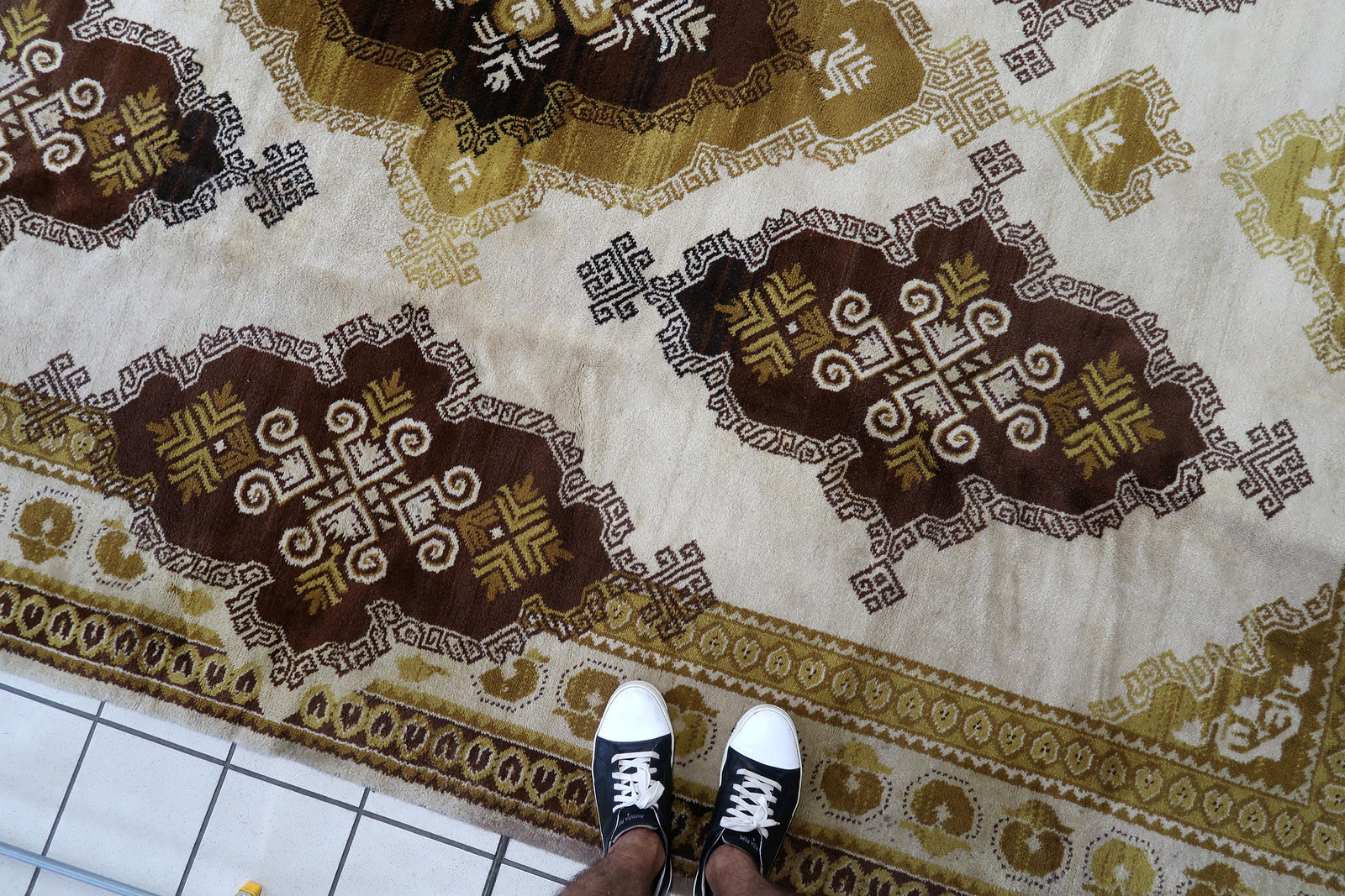 Vintage French Savonnerie rug in beige, brown and golden shades. The rug is from the middle of 20th century in original good condition.