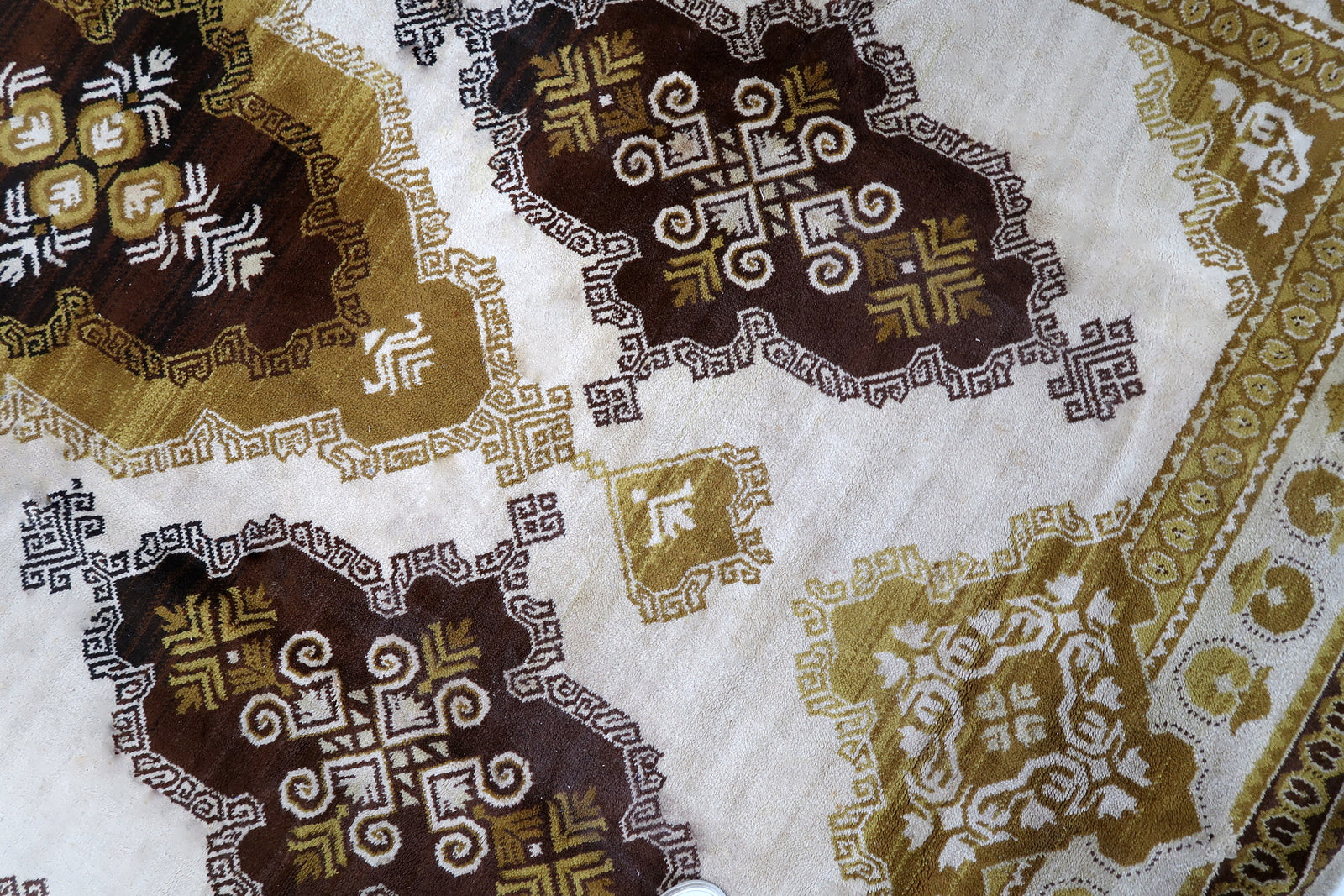 Vintage French Savonnerie rug in beige, brown and golden shades. The rug is from the middle of 20th century in original good condition.