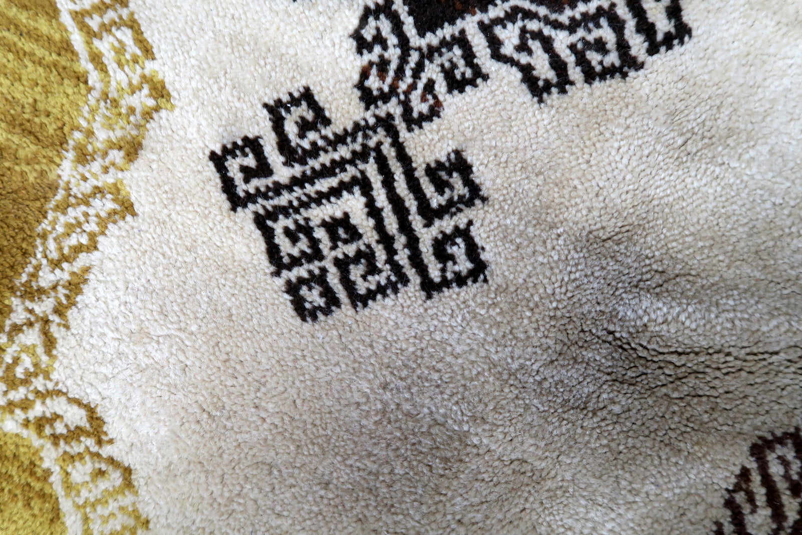 Vintage French Savonnerie rug in beige, brown and golden shades. The rug is from the middle of 20th century in original good condition.