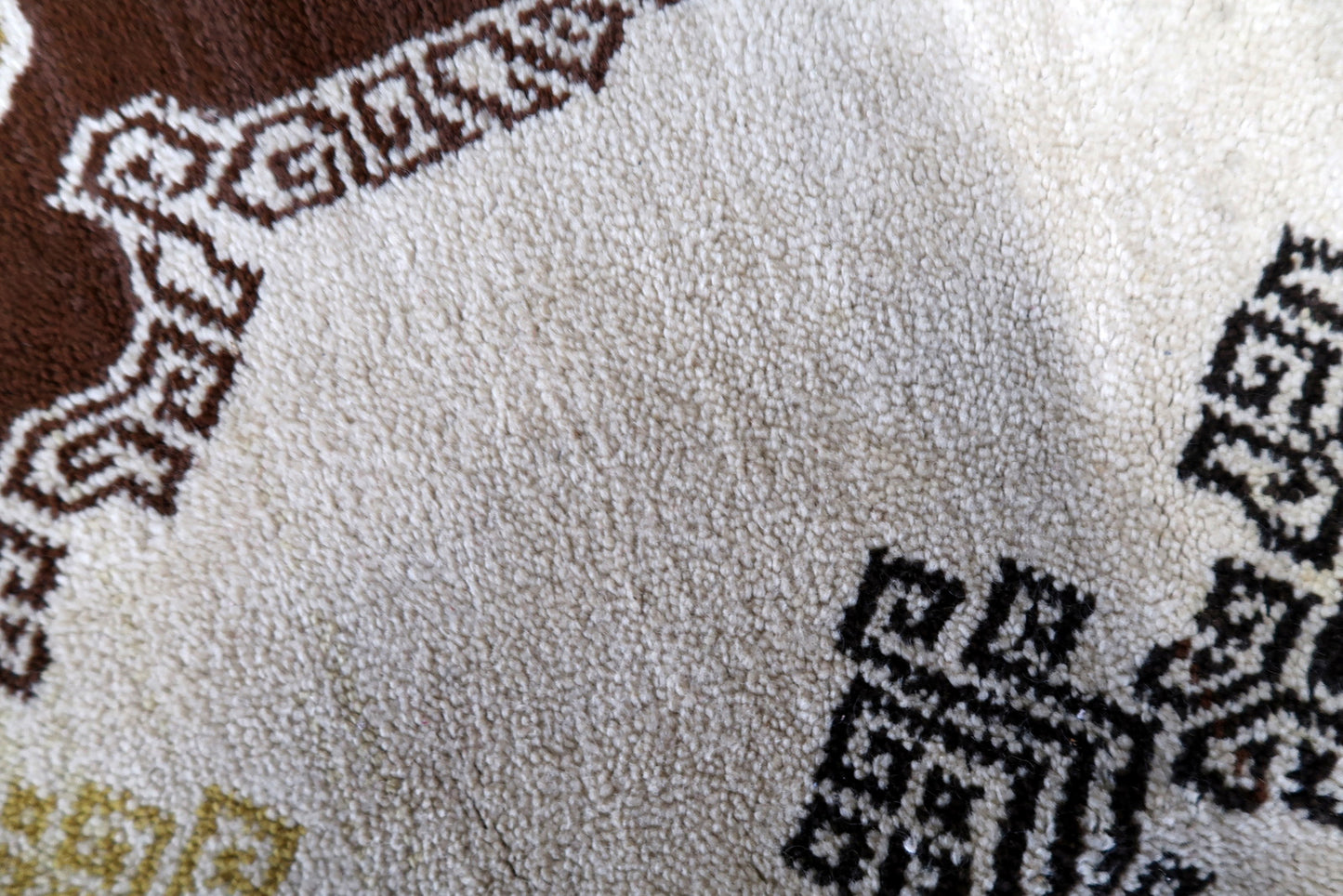 Vintage French Savonnerie rug in beige, brown and golden shades. The rug is from the middle of 20th century in original good condition.