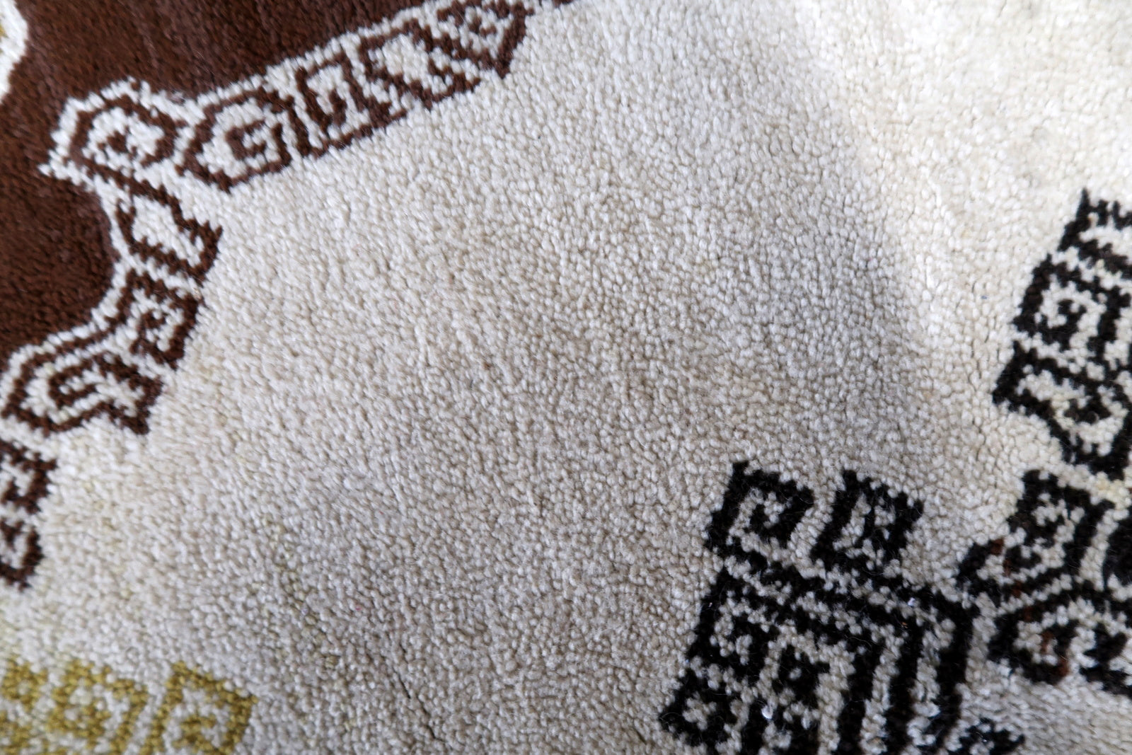 Vintage French Savonnerie rug in beige, brown and golden shades. The rug is from the middle of 20th century in original good condition.