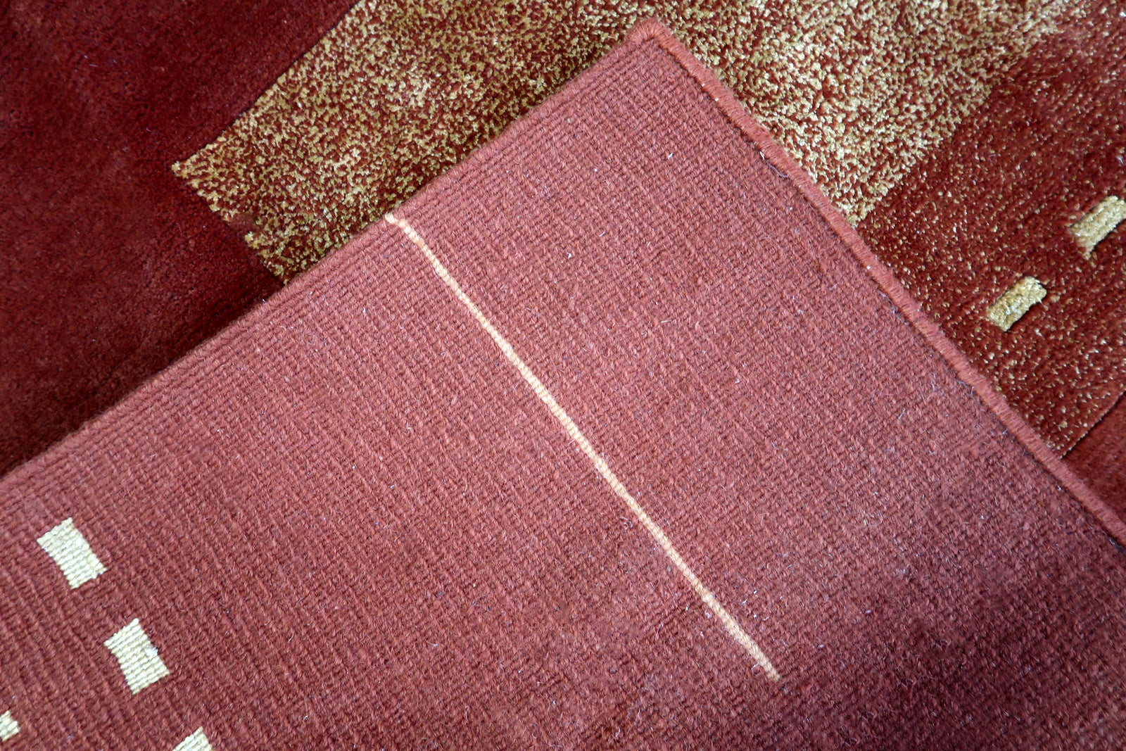 Handmade vintage Tibetan Khaden rug in modern geometric design. The rug is from the end of 20th century in original good condition.