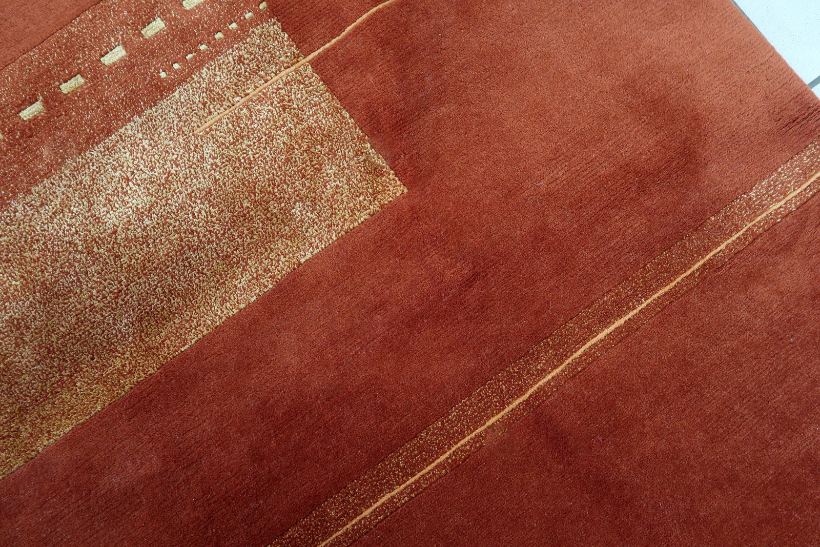 Handmade vintage Tibetan Khaden rug in modern geometric design. The rug is from the end of 20th century in original good condition.
