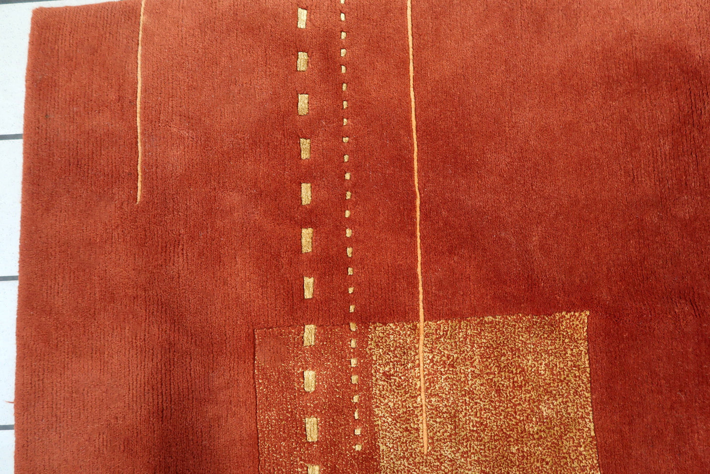 Handmade vintage Tibetan Khaden rug in modern geometric design. The rug is from the end of 20th century in original good condition.