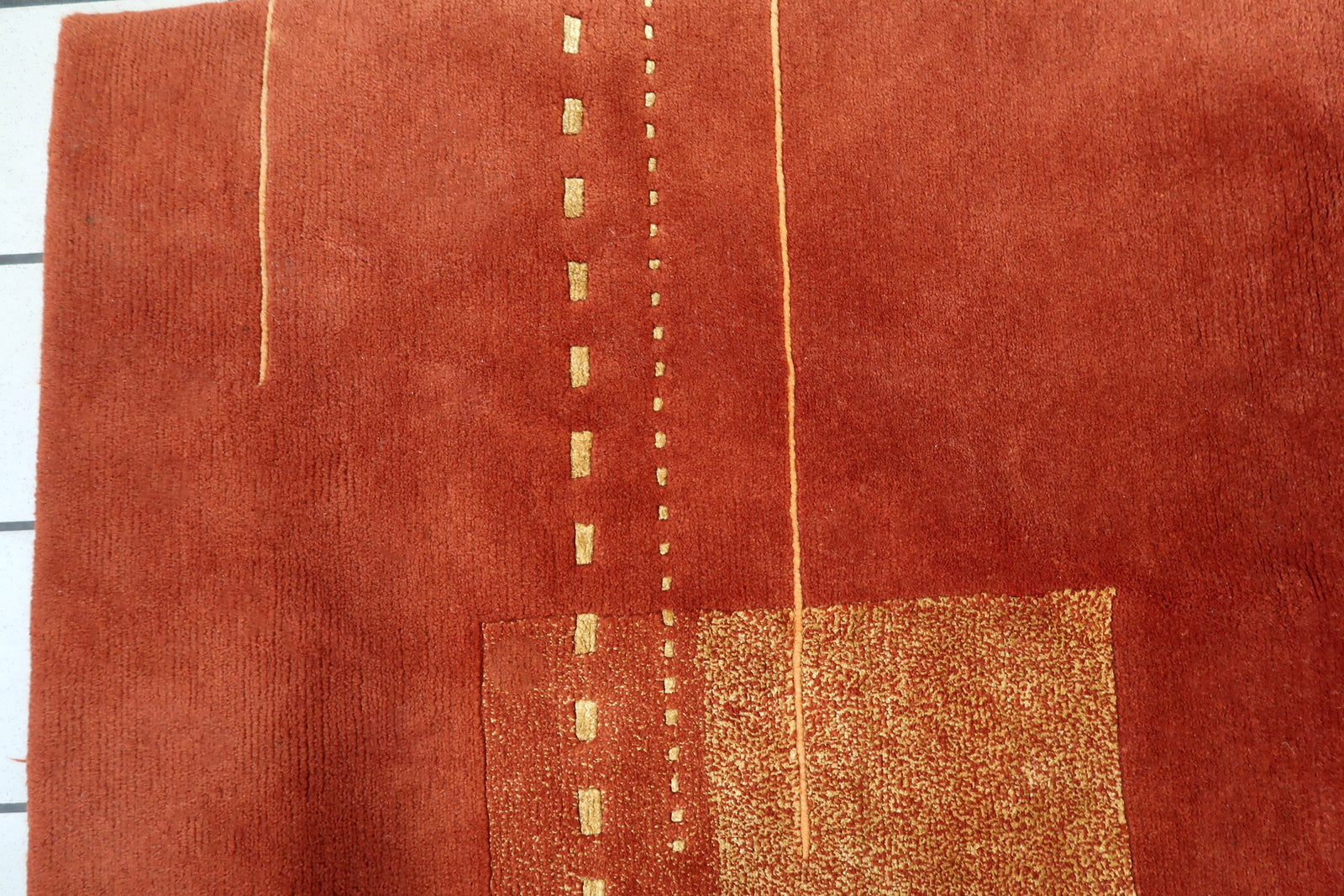 Handmade vintage Tibetan Khaden rug in modern geometric design. The rug is from the end of 20th century in original good condition.