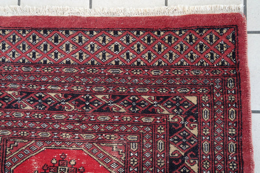 Handmade vintage Uzbek Bukhara rug 1970s