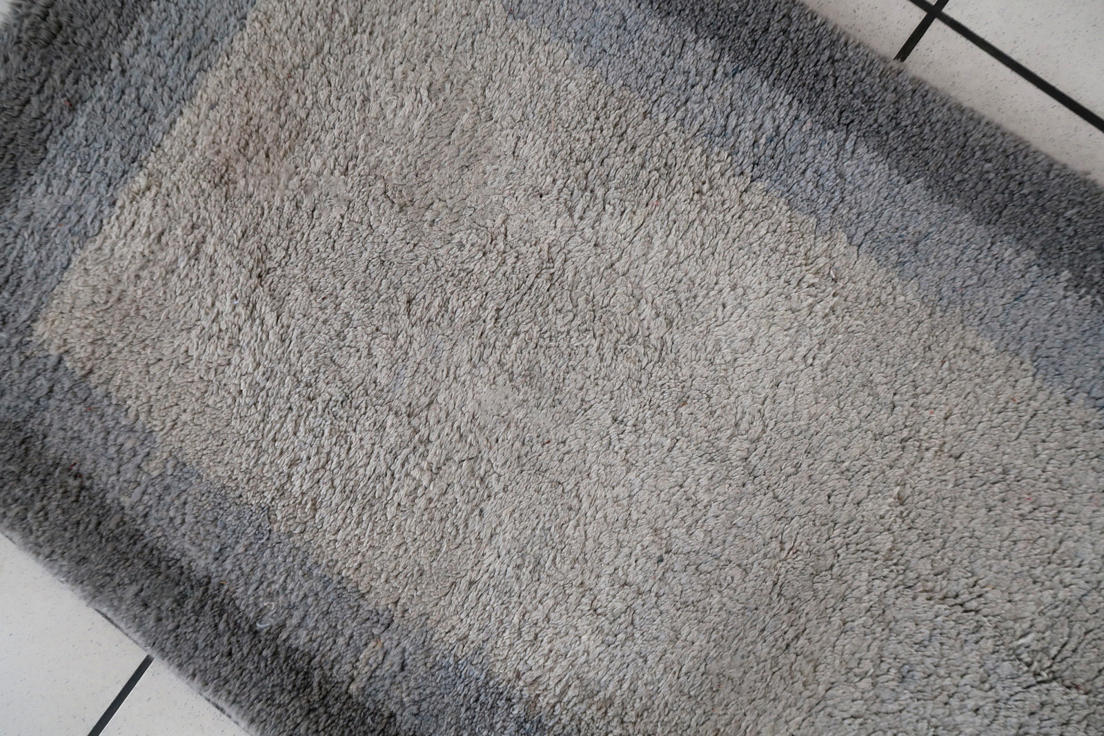 Handmade vintage Persian Gabbeh runner in different shades of grey color. The rug is from the end of 20th century in original good condition.