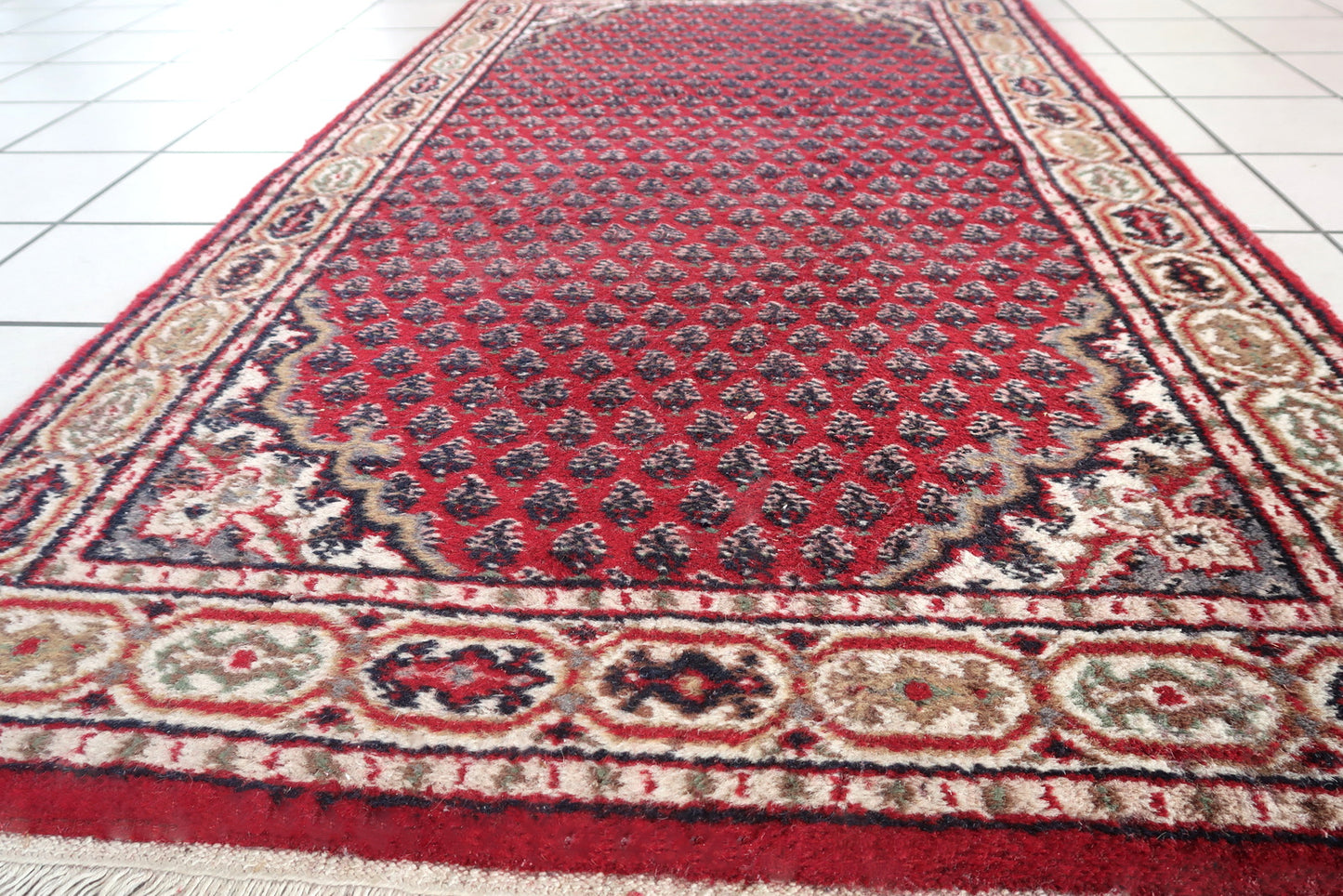 Handmade vintage Indian Seraband rug in traditional all-over design. The rug is form the end of 20th century in original good condition.