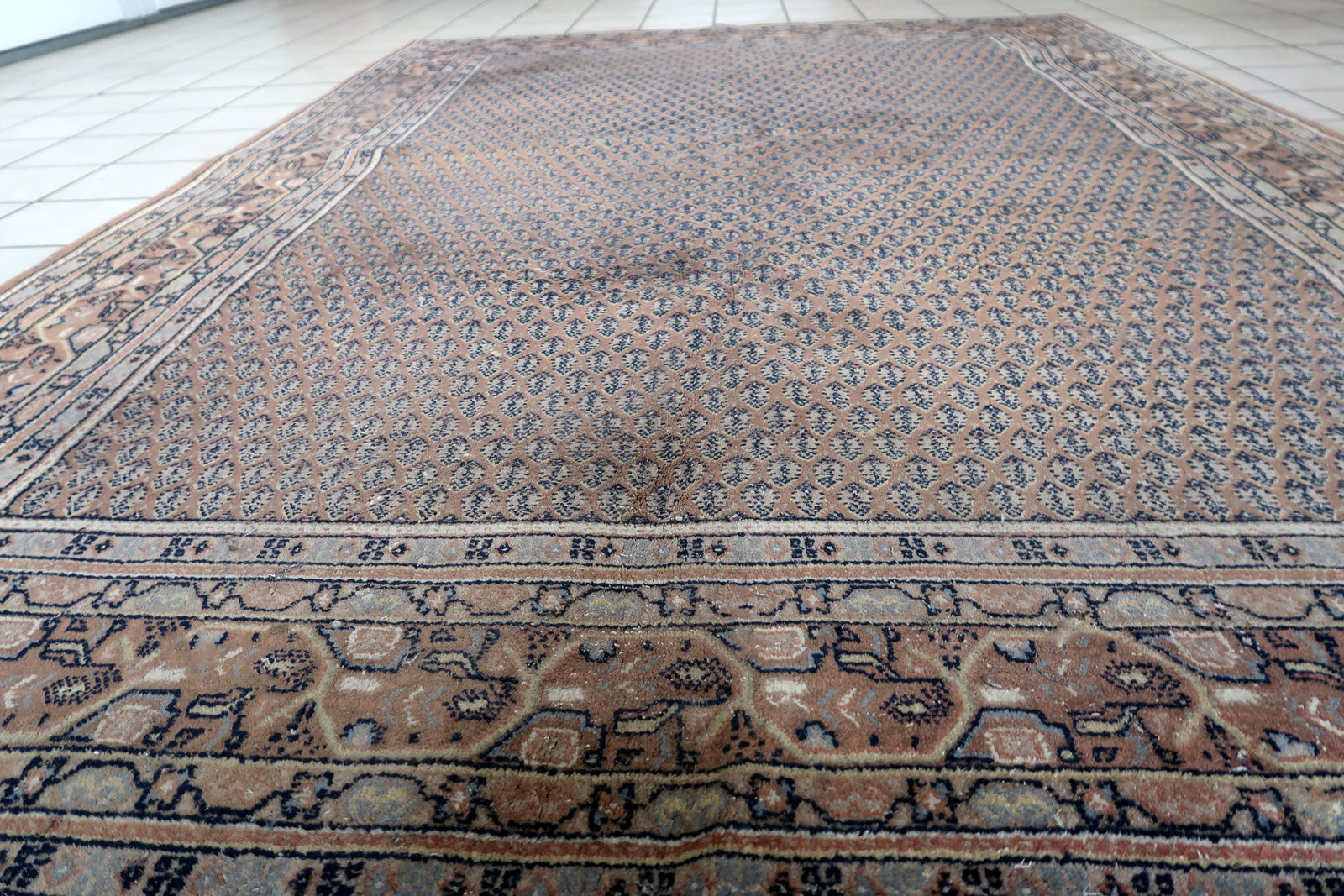 Handmade vintage Indian with Persian Seraband design in unusual brown color. The rug is from the end of 20th century in original good condition, it has minimal signs of age.