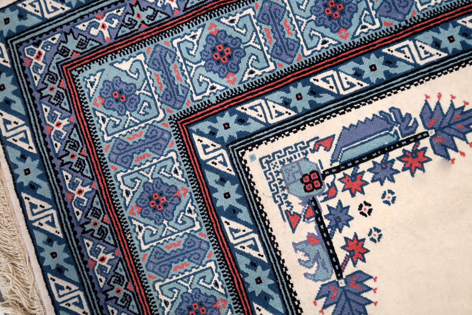 Handmade vintage Tunisian Berber rug in unusual white and blue colors. The rug is from the end of 20th century in original condition, it has some age discolorations.