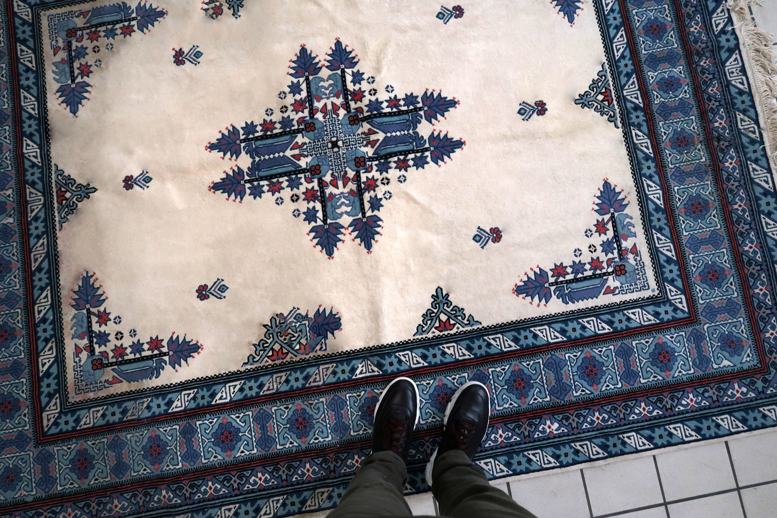 Handmade vintage Tunisian Berber rug in unusual white and blue colors. The rug is from the end of 20th century in original condition, it has some age discolorations.