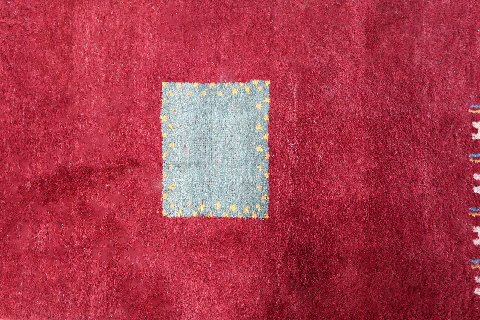 Handmade vintage Persian Gabbeh rug in deep red color and geometric design. The rug is from the end of 20th century in original good condition.