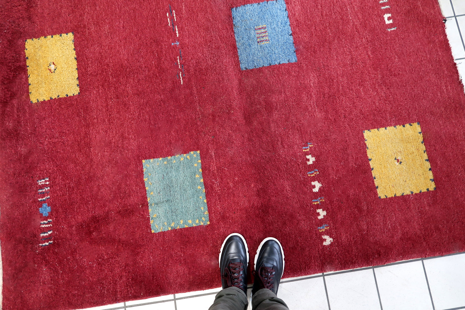 Handmade vintage Persian Gabbeh rug in deep red color and geometric design. The rug is from the end of 20th century in original good condition.