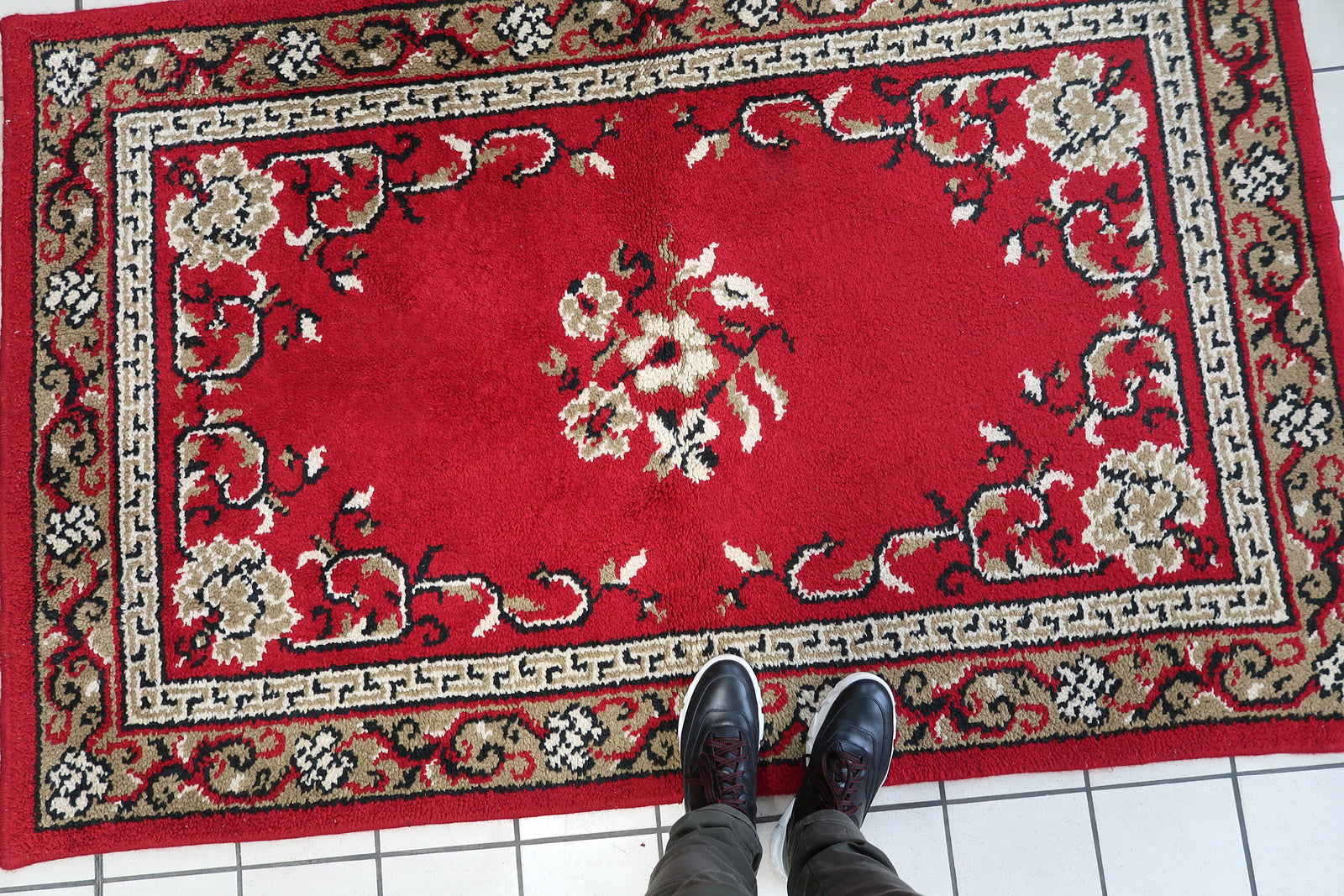 Vintage French Savonnerie woolen rug in bright red color and floral design. The rug is from the end of 20th century in original good condition.