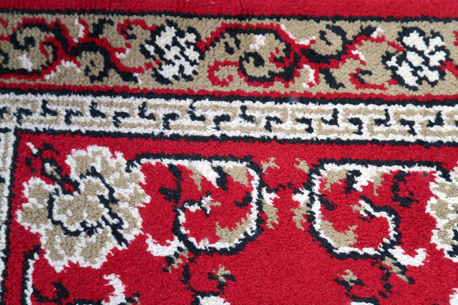 Vintage French Savonnerie woolen rug in bright red color and floral design. The rug is from the end of 20th century in original good condition.
