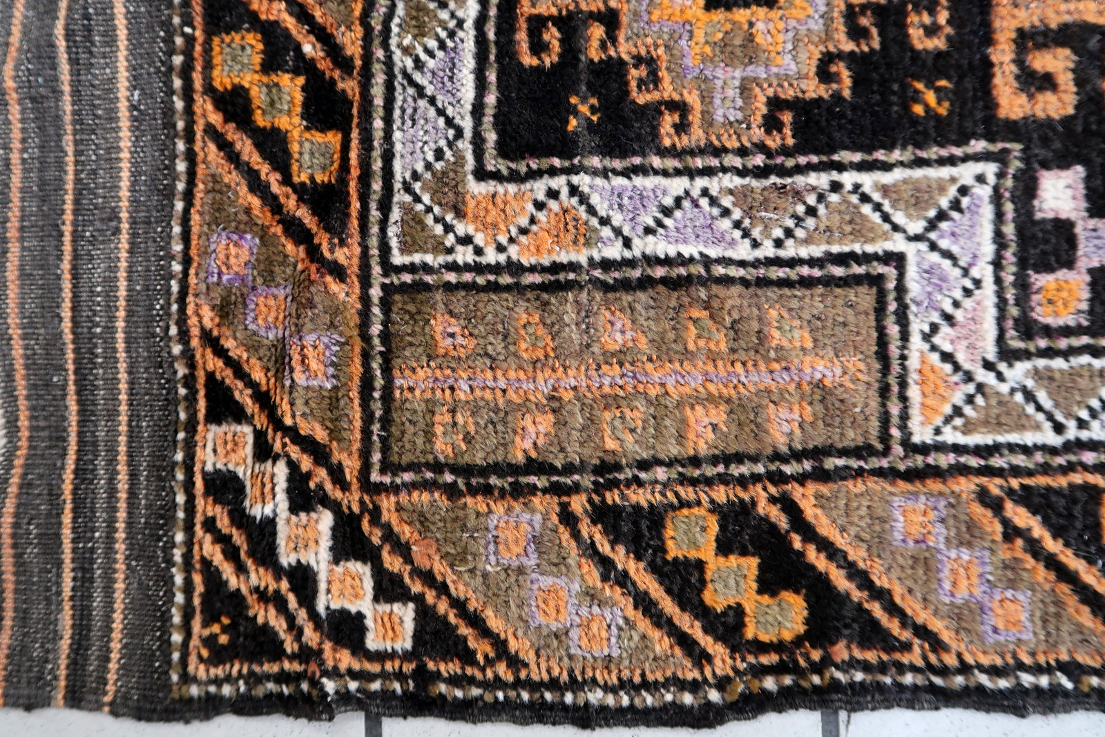 Handmade antique collectible Afghan Baluch rug in tribal prayer design. The rug is from the middle of 20th century in original good condition.