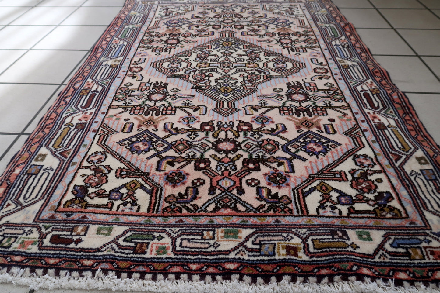 Handmade vintage Persian Malayer rug in pink color. The rug is from the middle of 20th century in original good condition.