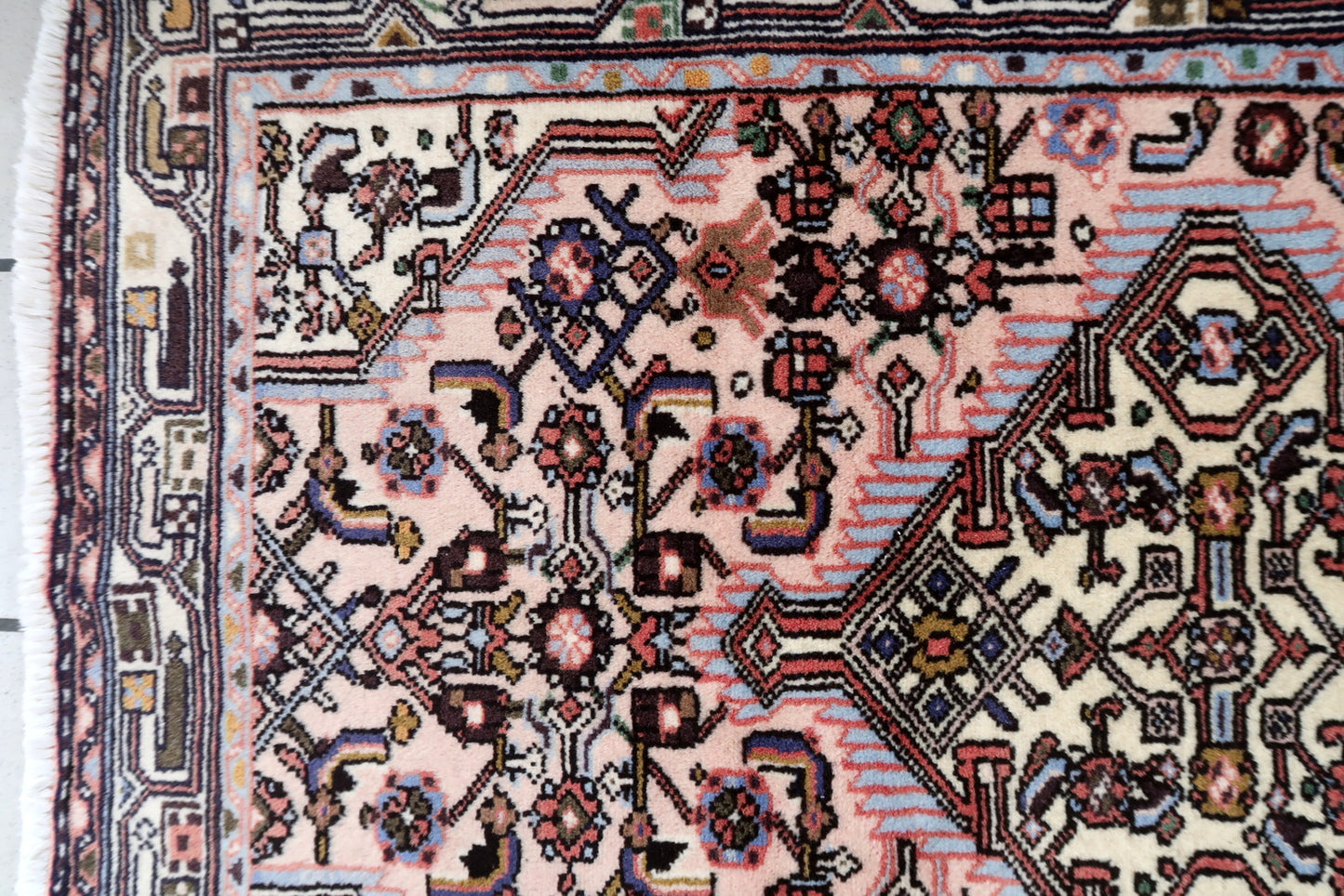 Handmade vintage Persian Malayer rug in pink color. The rug is from the middle of 20th century in original good condition.