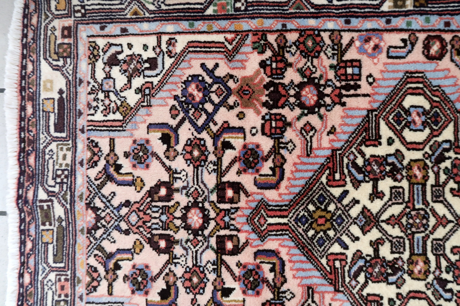 Handmade vintage Persian Malayer rug in pink color. The rug is from the middle of 20th century in original good condition.