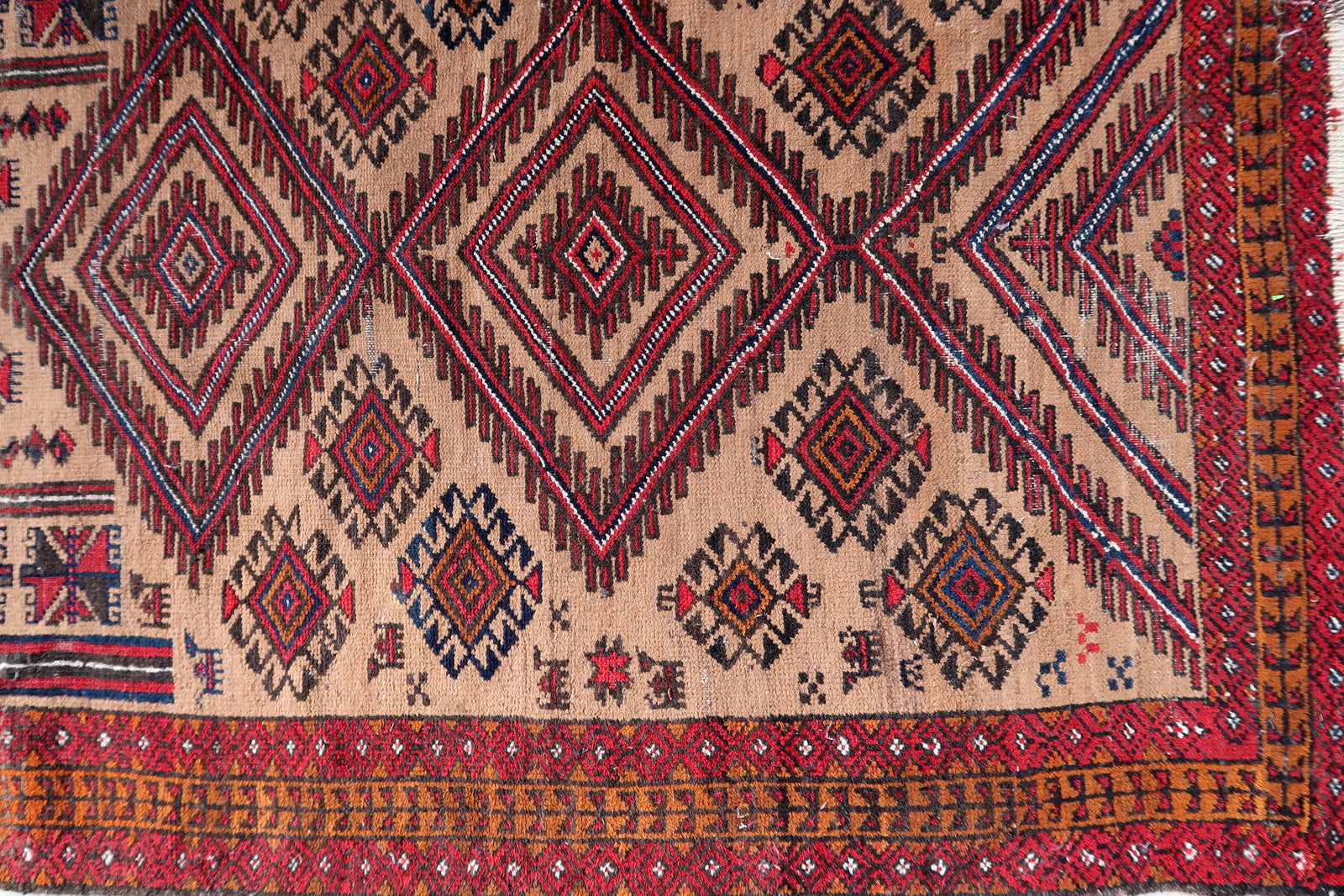 Handmade antique Afghan Baluch rug in tribal prayer design. The rug is from the beginning of 20th century in original condition, it has some low pile.
