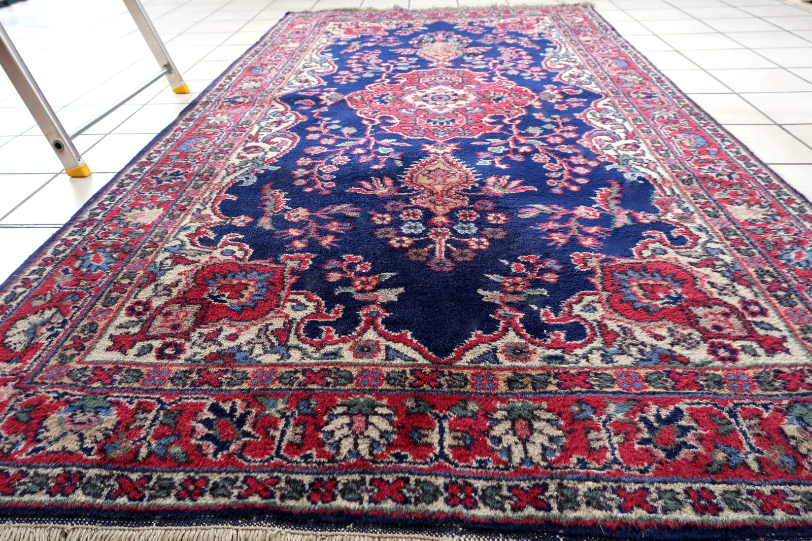 Handmade antique Persian Kerman rug in bright blue and red shades. The rug is from the beginnig of 20th century in good condition.